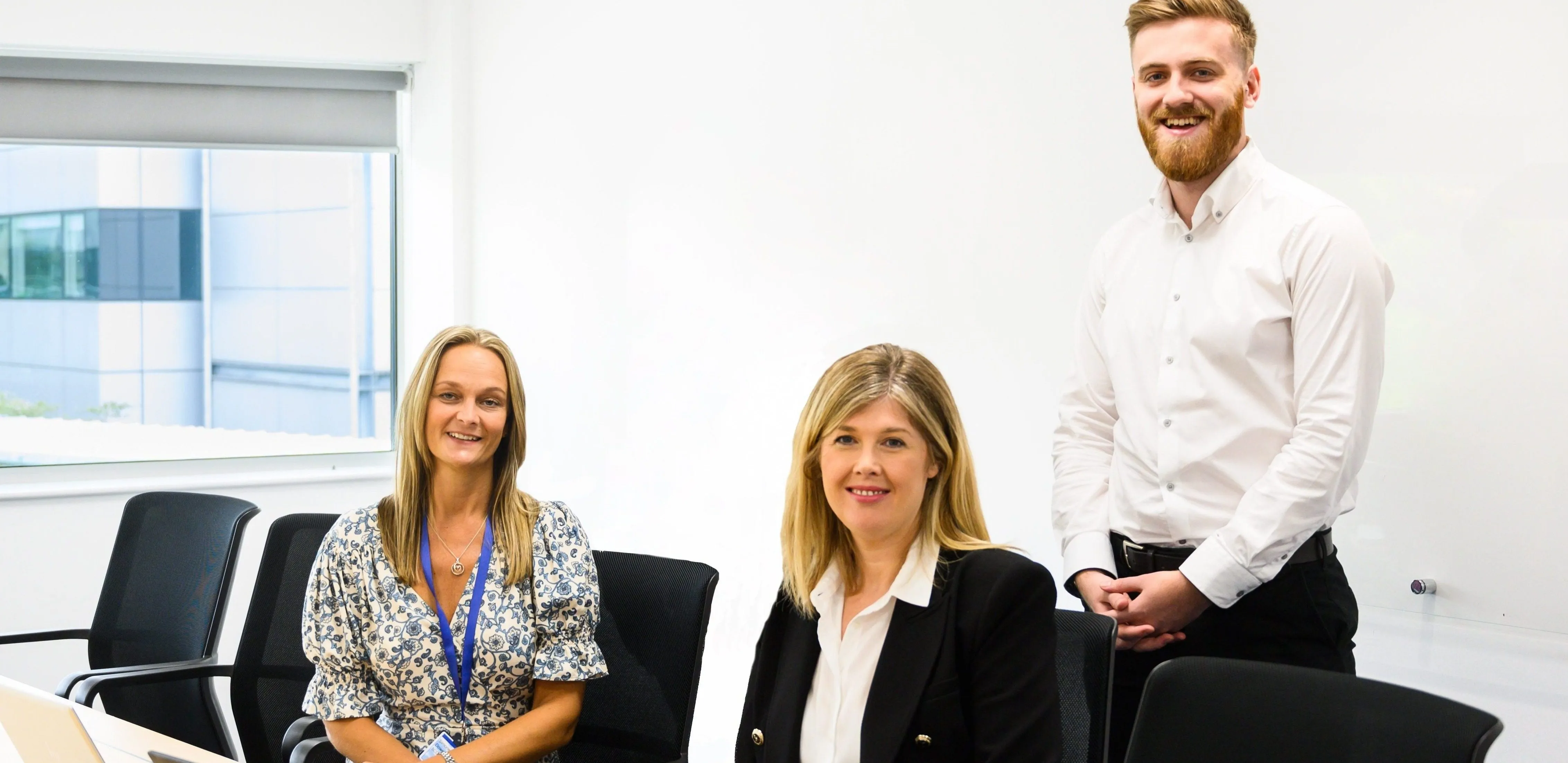 Meet the team at Computacenter: three colleagues smiling and ready to collaborate in a modern office.