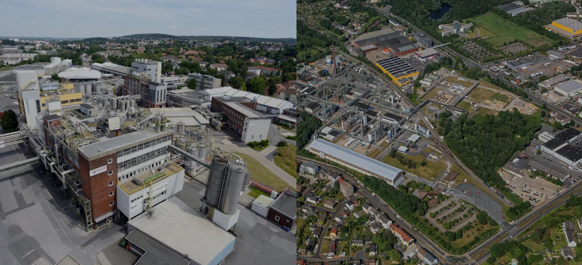 Luftaufnahme einer Evonik-Industrieanlage und der umliegenden Stadtlandschaft im Bereich Energie und Versorgung.