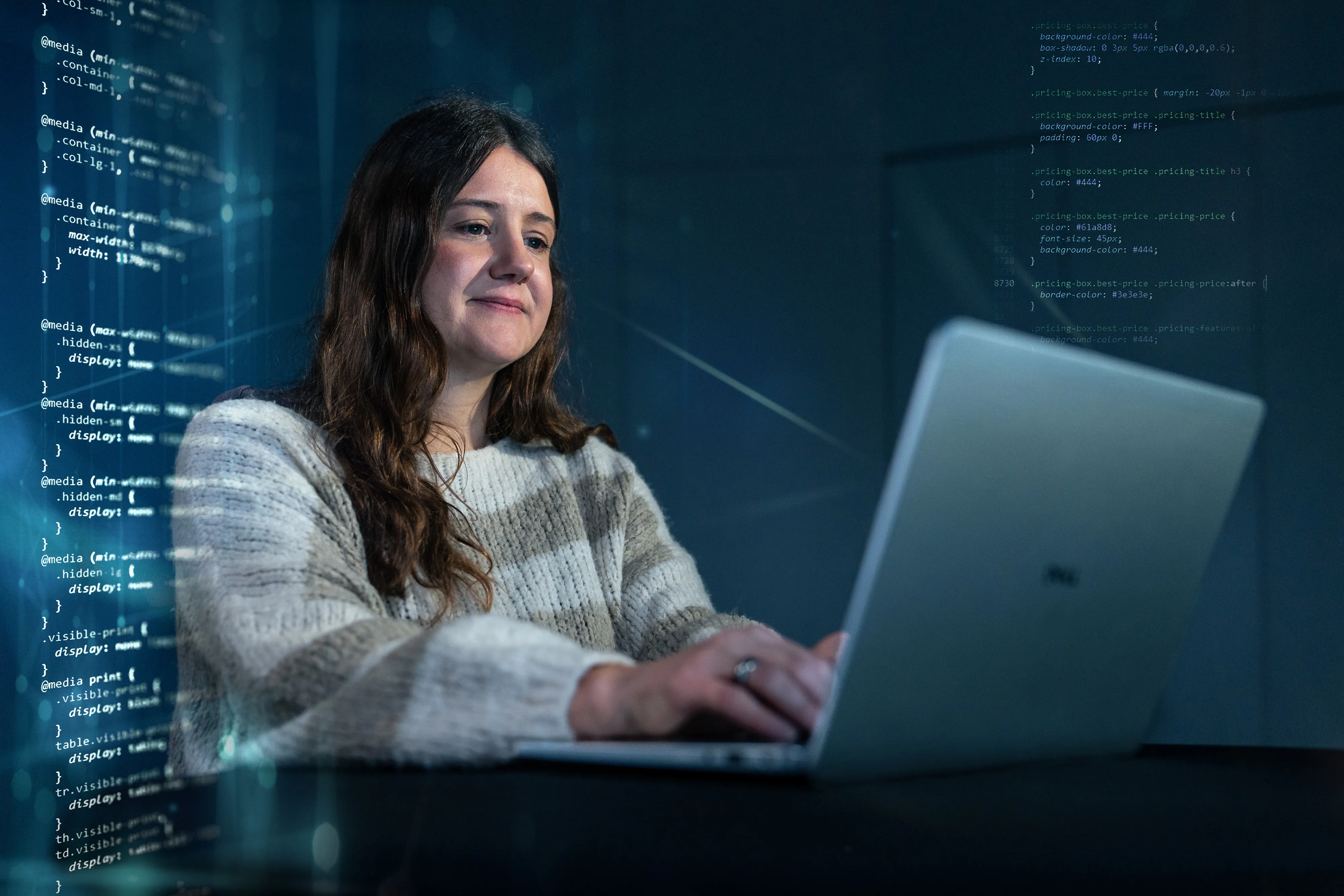 A woman codes on her laptop, surrounded by digital lines of code