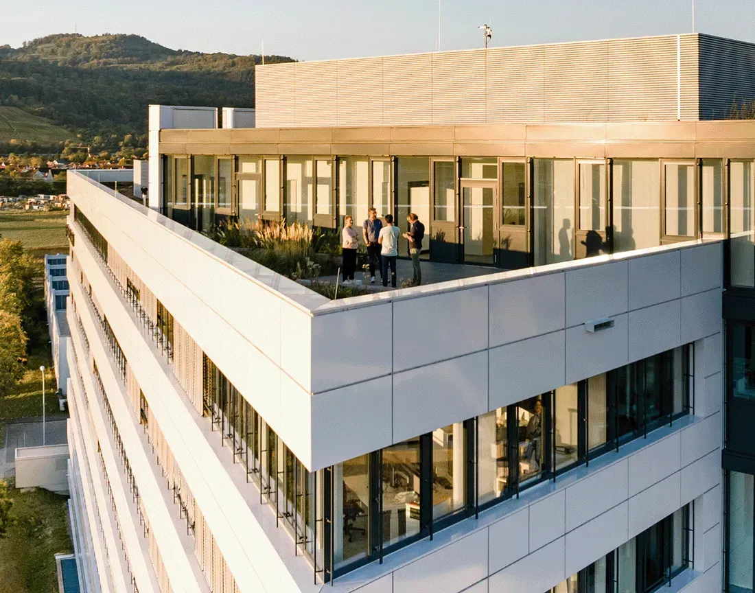 Team chilling on the sunny rooftop terrace of the Haufe Group office building