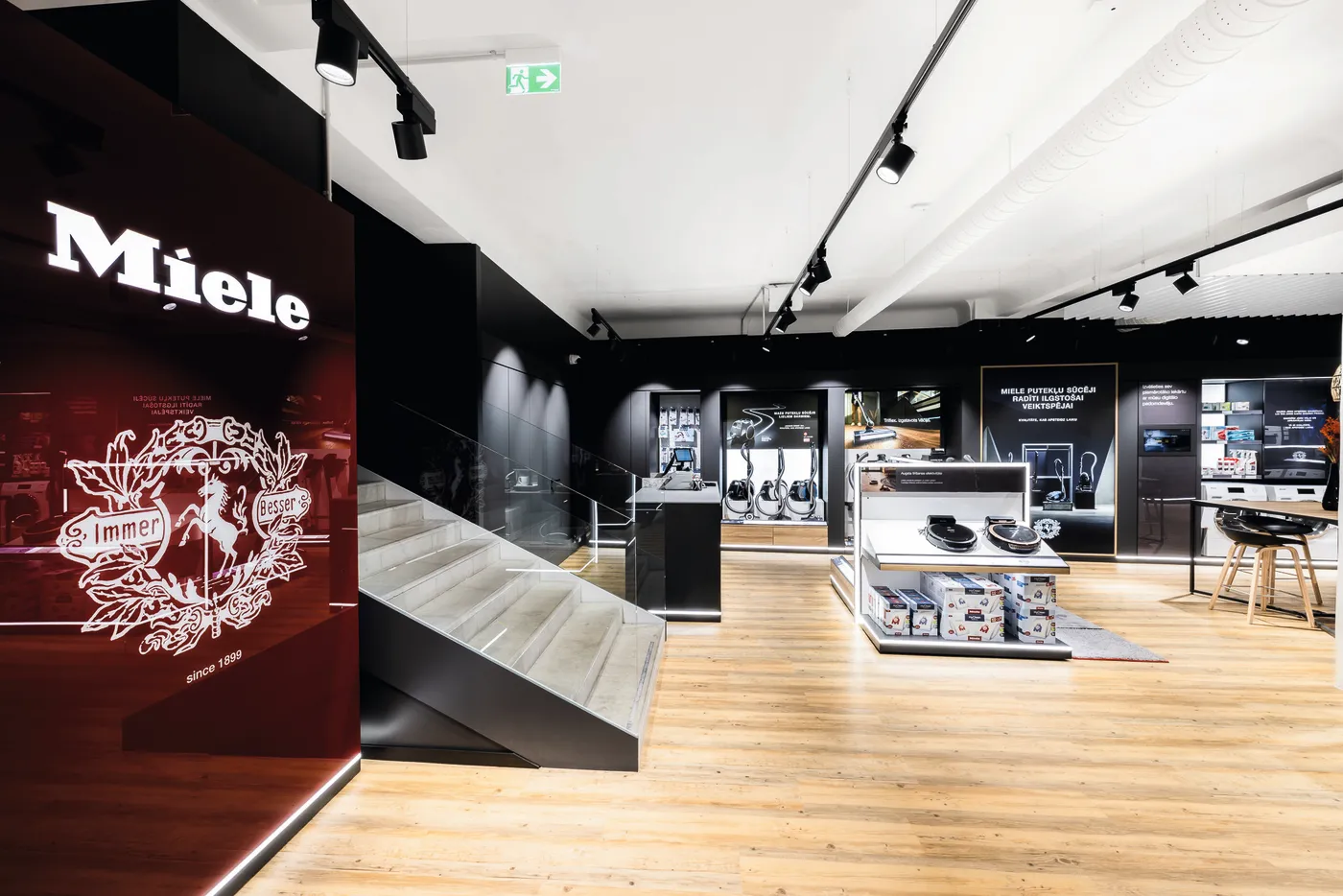 Modern Miele showroom in the Baltic Region with sleek appliances and stylish displays, showcasing the innovation of their manufacturing.
