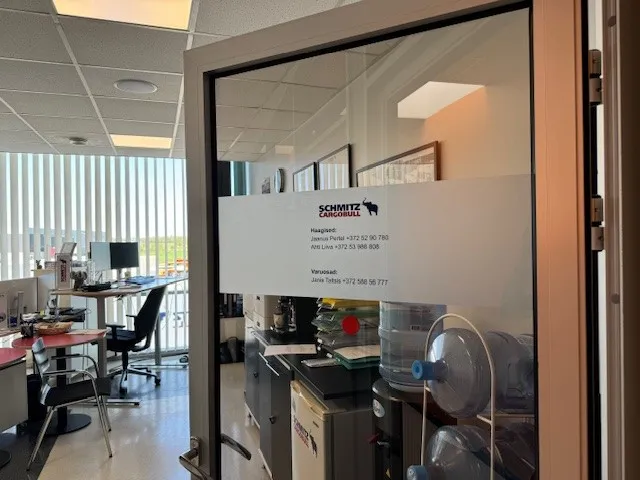 Peek into our Schmitz Cargobull AG office—bright workspace with desks, chairs, and office essentials ready for action!