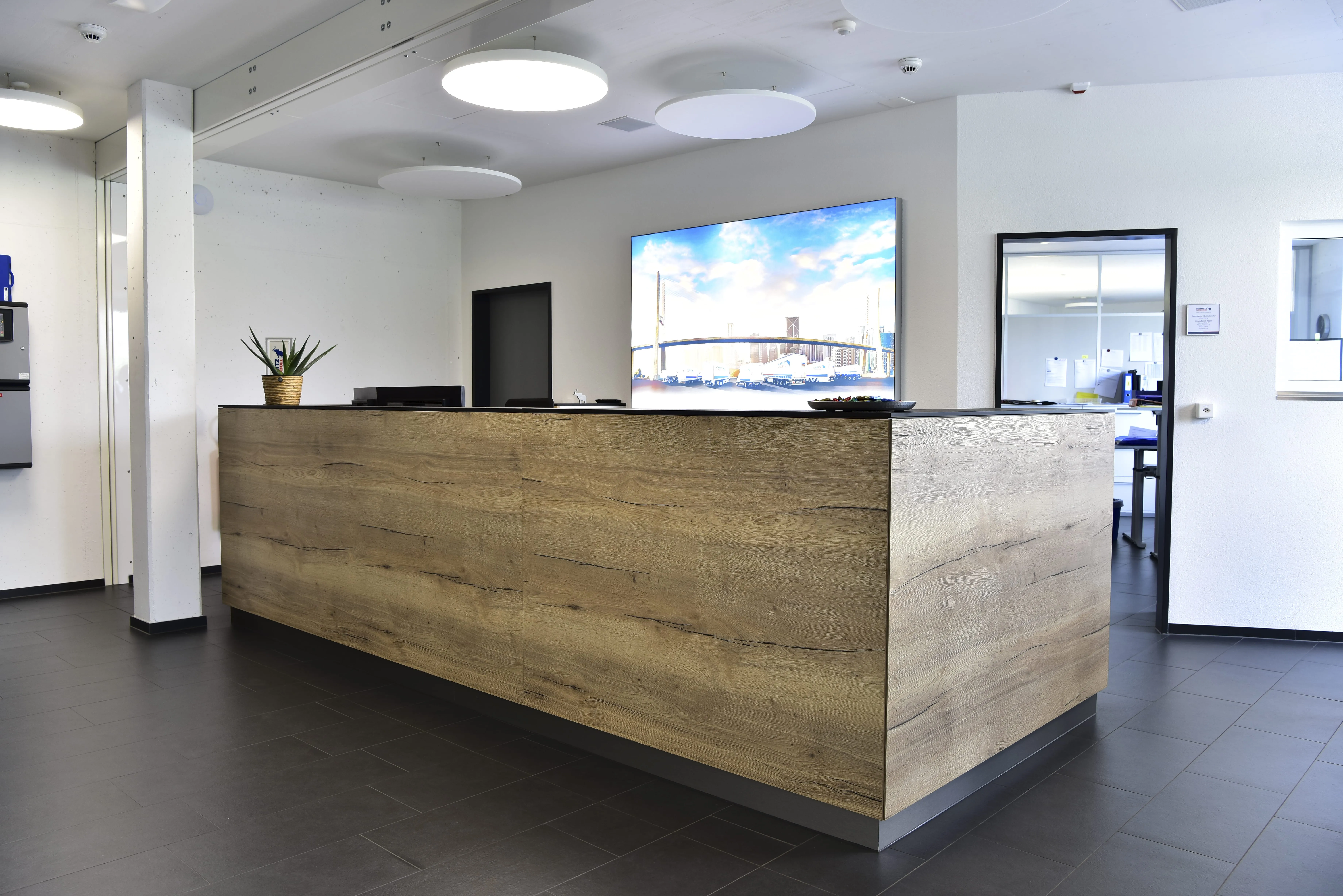 Welcome to Schmitz Cargobull AG! Check out our sleek and modern reception area, ready to greet you.