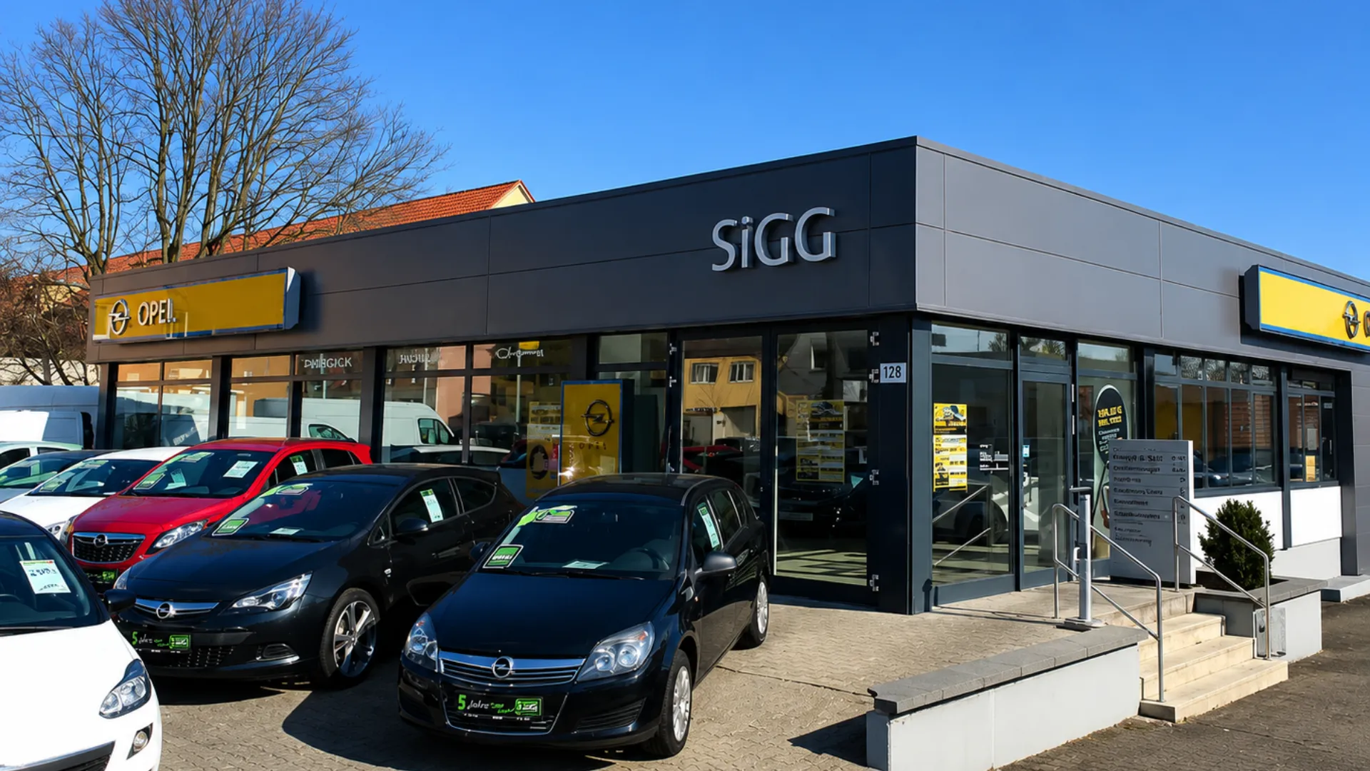 Außenansicht eines Opel-Autohauses mit mehreren Fahrzeugen – starte Deine Karriere in der Automobilbranche bei Stellantis.
