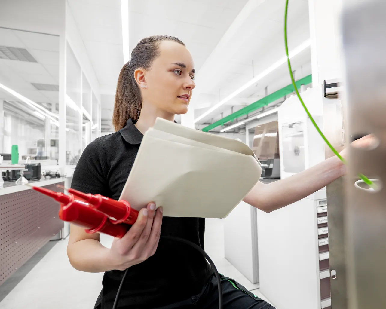 working young woman in Syntegon shirt